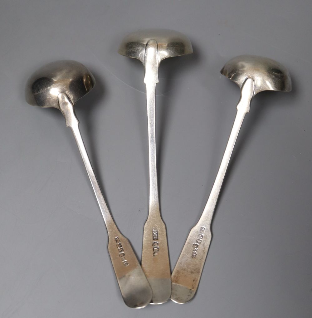 Three Scottish silver fiddle and shell pattern cream ladles, including a pair by John Zeigler, Edinburgh 1811.